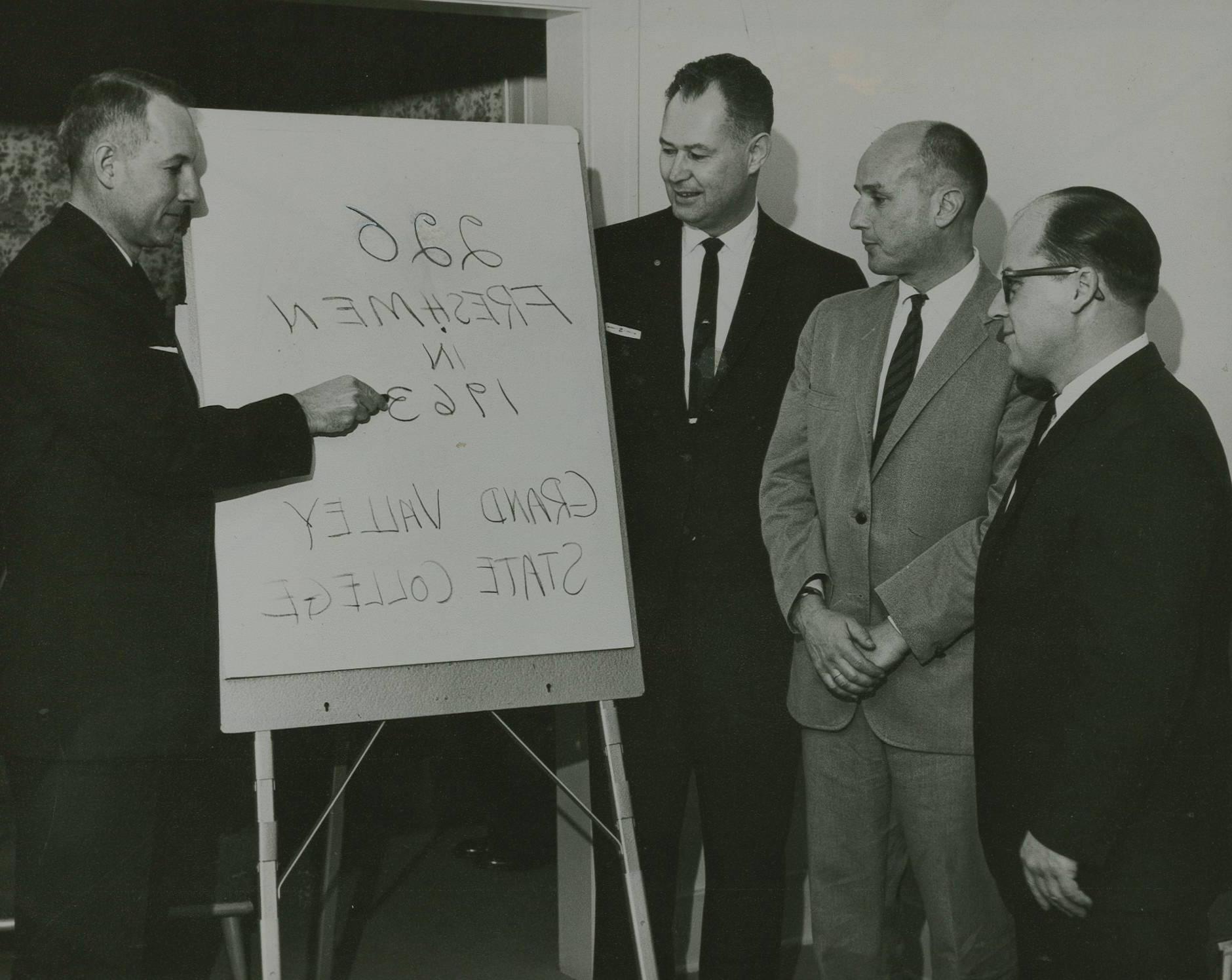 Dr. Arnold C. Ott (left) plans the future Grand Valley State University